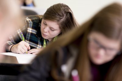 Student taking notes