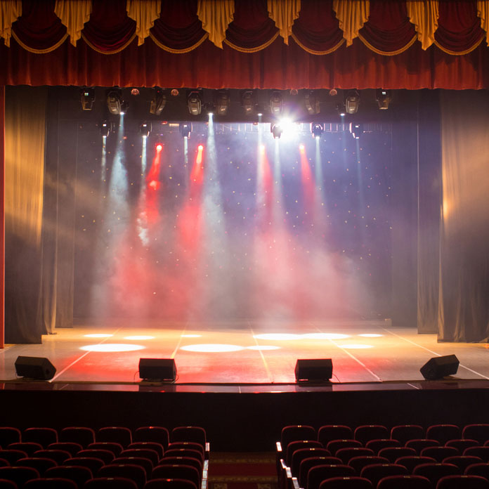 Theatrical stage with colorful lighting and haze