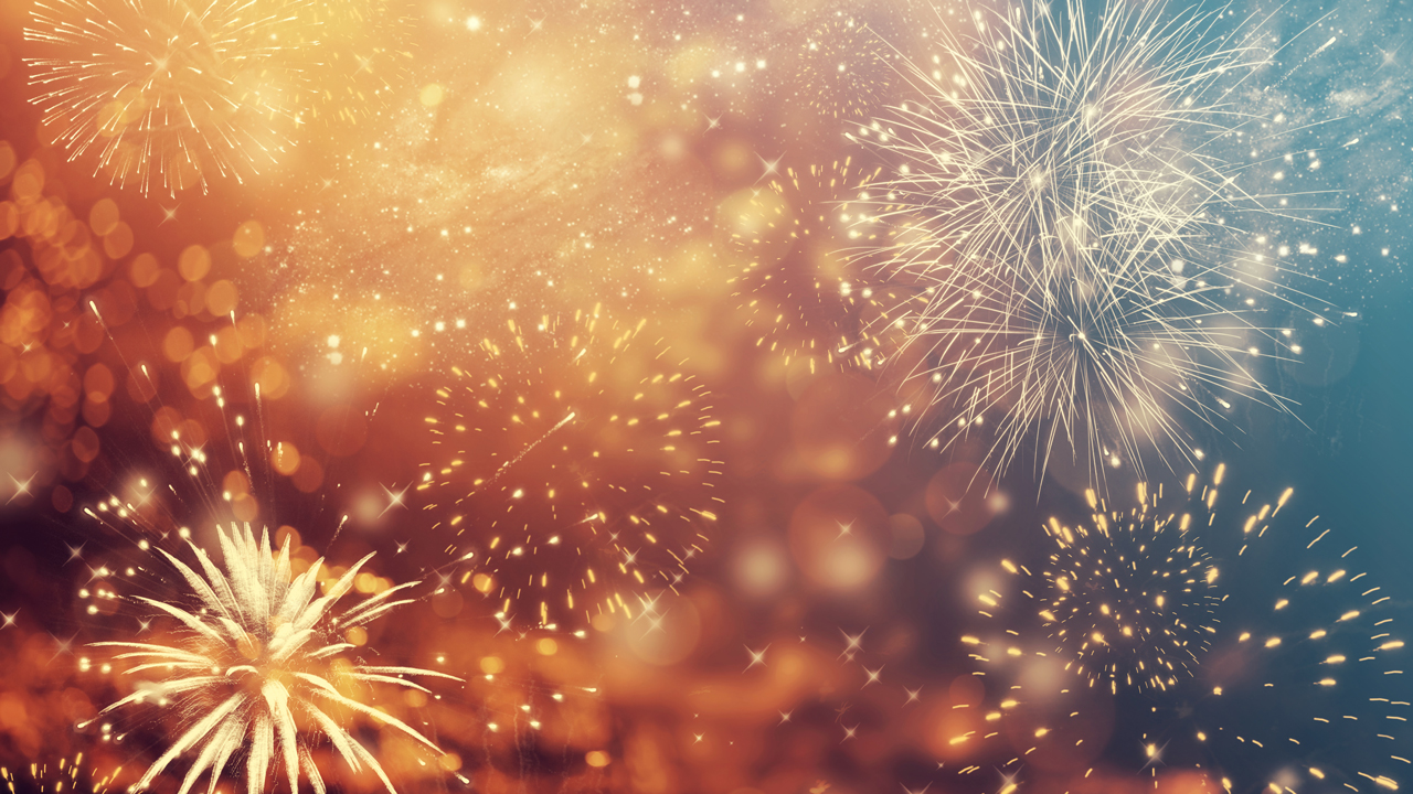 Golden colored fireworks in sky