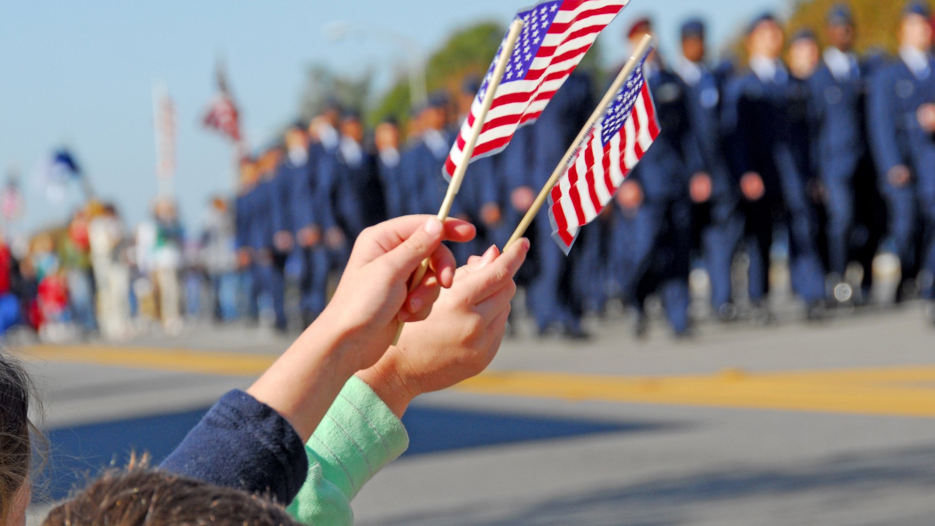 Handheld American Flags at Parade