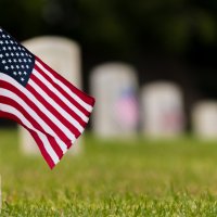 Small American flag in veteran cemetery