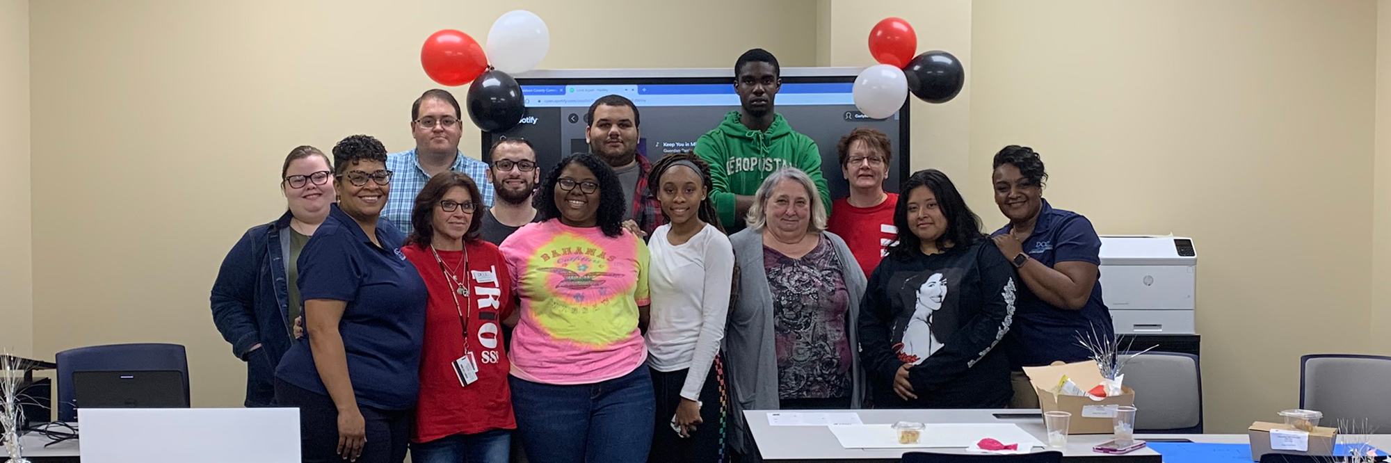 Group of TRIO students in front of large screen