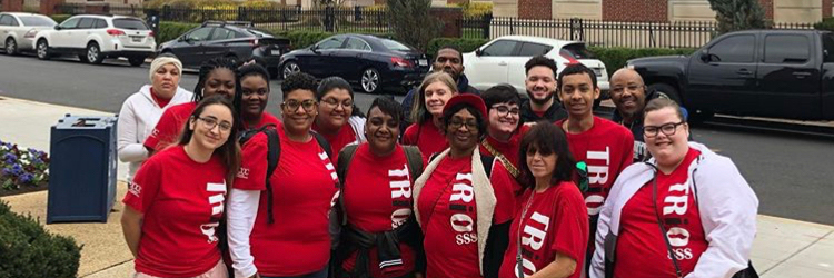 Group of Trio students wearing red Trio students outside