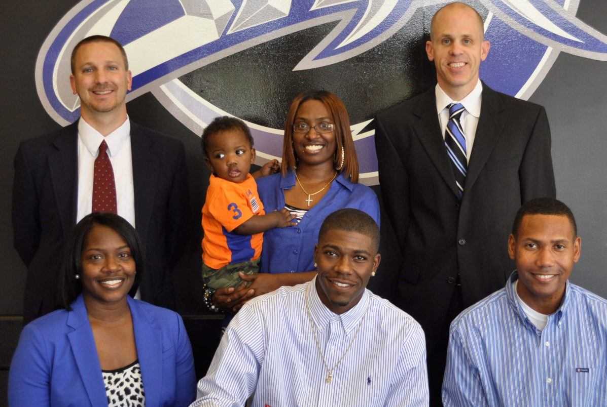 Basketball player, his family and coaches