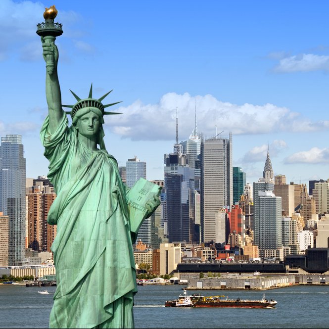 Statue of Liberty in front of New York Skyline