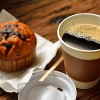 Coffee and muffin on table