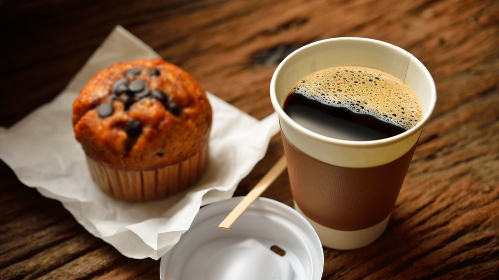 Coffee and muffin on table