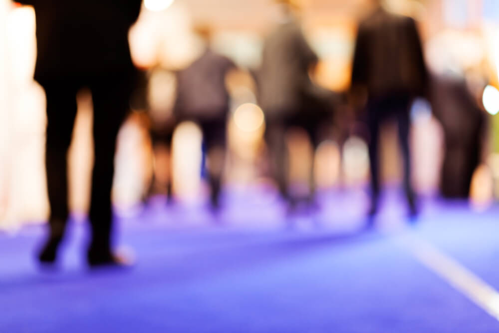 blurred image of a group of people in business clothes