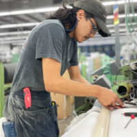 Young Apprentice works in industrial facility