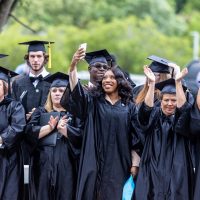 Group of graduates in black cap and gown
