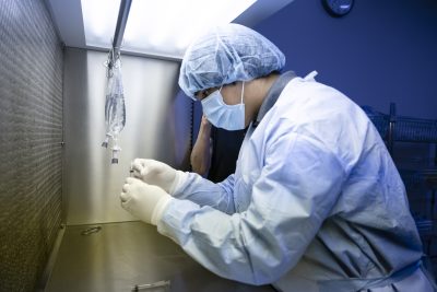 pharmacy student with mask and hairnet