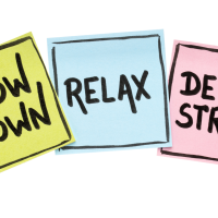 Three sticky notes displaying the words "Slow Down", "Relax", "De Stress".