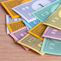 Colorful play money sitting on table.