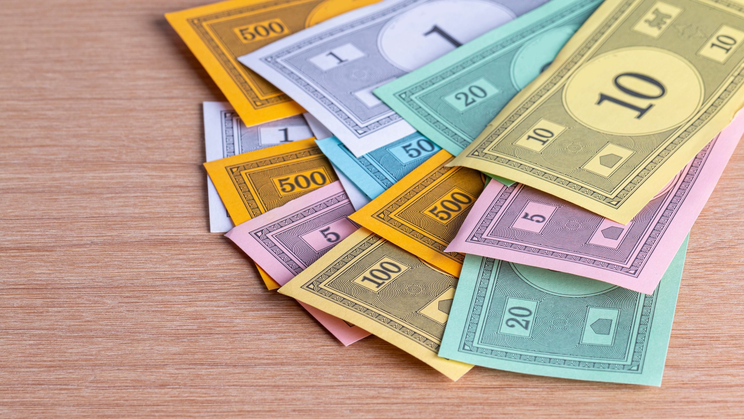 Colorful play money sitting on table.