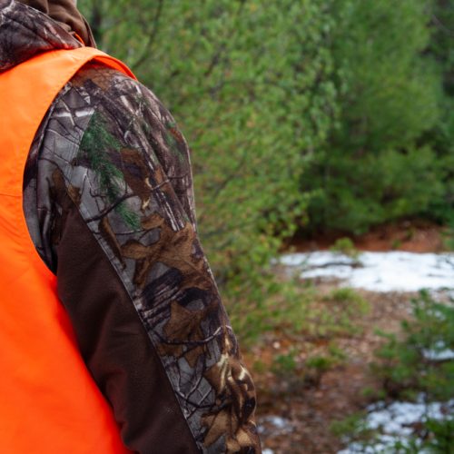 Person,In,Camouflage,Wearing,A,Hunter,Orange,Vest,To,Be Person,In,Camouflage,Wearing,A,Hunter,Orange,Vest,To,Be
